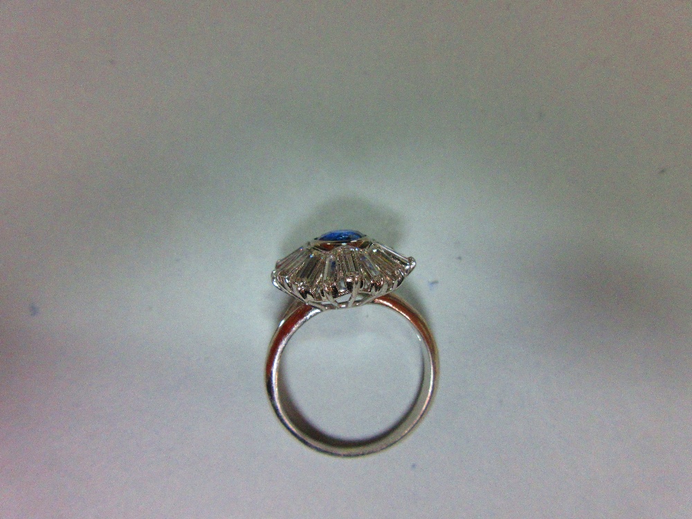 A sapphire and diamond sunburst cluster ring, the round cut light indigo coloured sapphire collet - Image 4 of 5