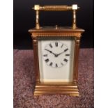 A French gilt brass carriage clock with repeat, the pillared case with silvered platform lever