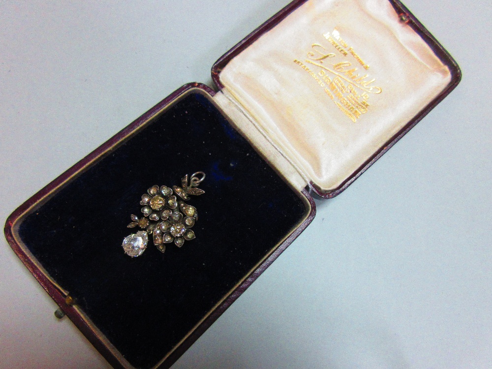 A period diamond pendant with pear cut drop, designed as two flowers each with six petals and - Image 6 of 6