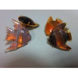 A pair of carved agate angel fish double ended cufflinks, each shaped piece of translucent banded
