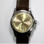 By Omega - a gentleman's mid-sized steel cased wrist watch, circa 1940's, the champagne coloured