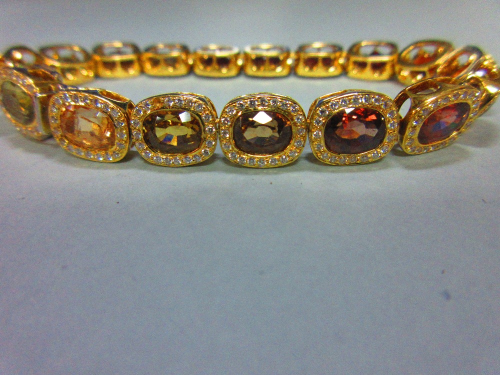 A multi gem set and diamond bracelet, each of the eighteen oval cut stones set in a border of - Image 4 of 8