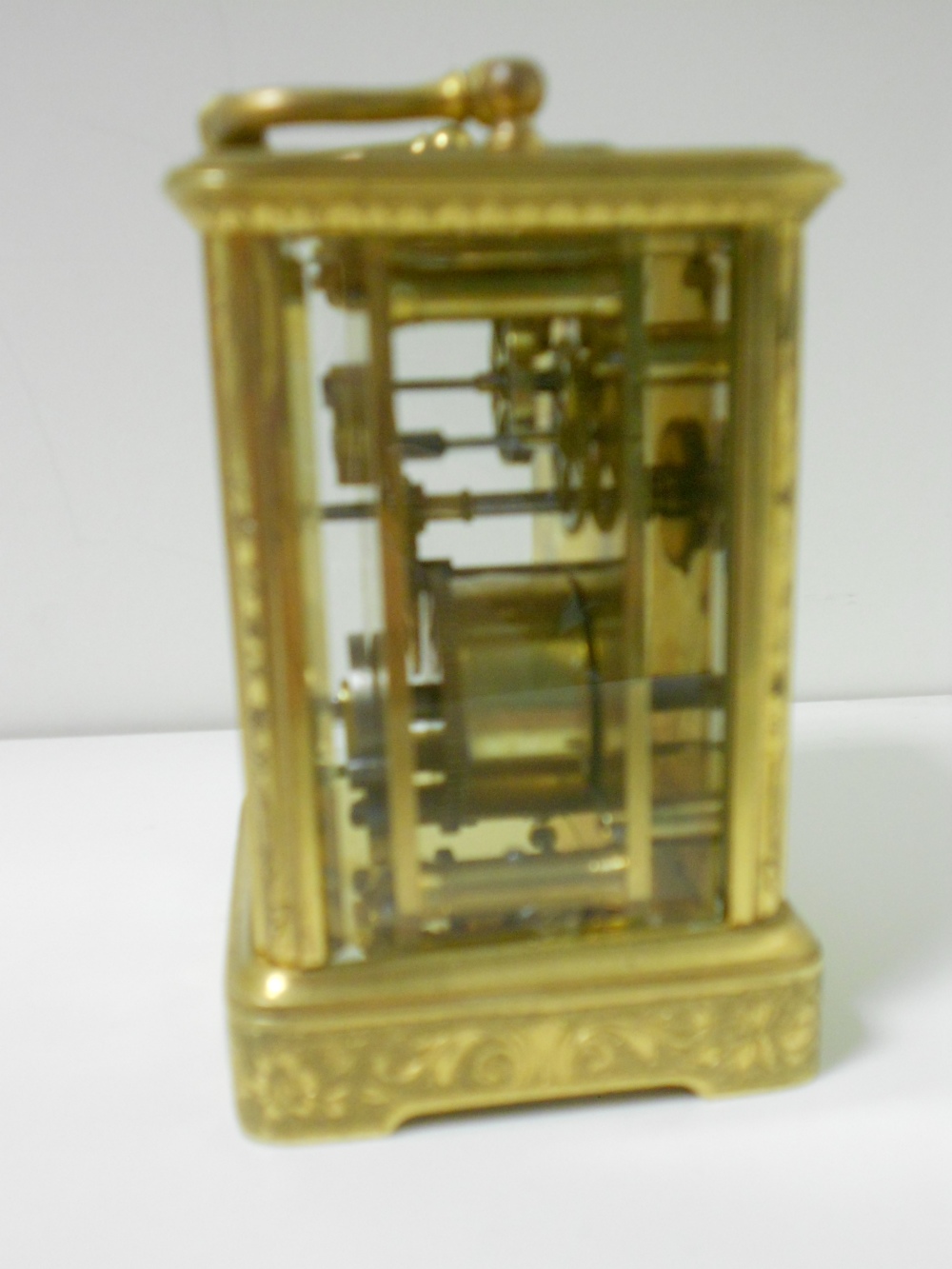 A small French gilt brass carriage timepiece, with floral scroll engraved case and 4.5cm rectangular - Image 2 of 4