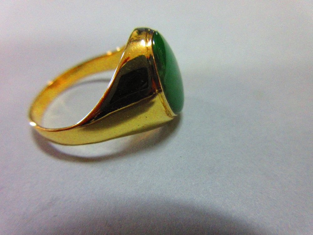 A jade signet form ring, set with a low cabochon polished mid-green jade in rubover setting - Image 5 of 5