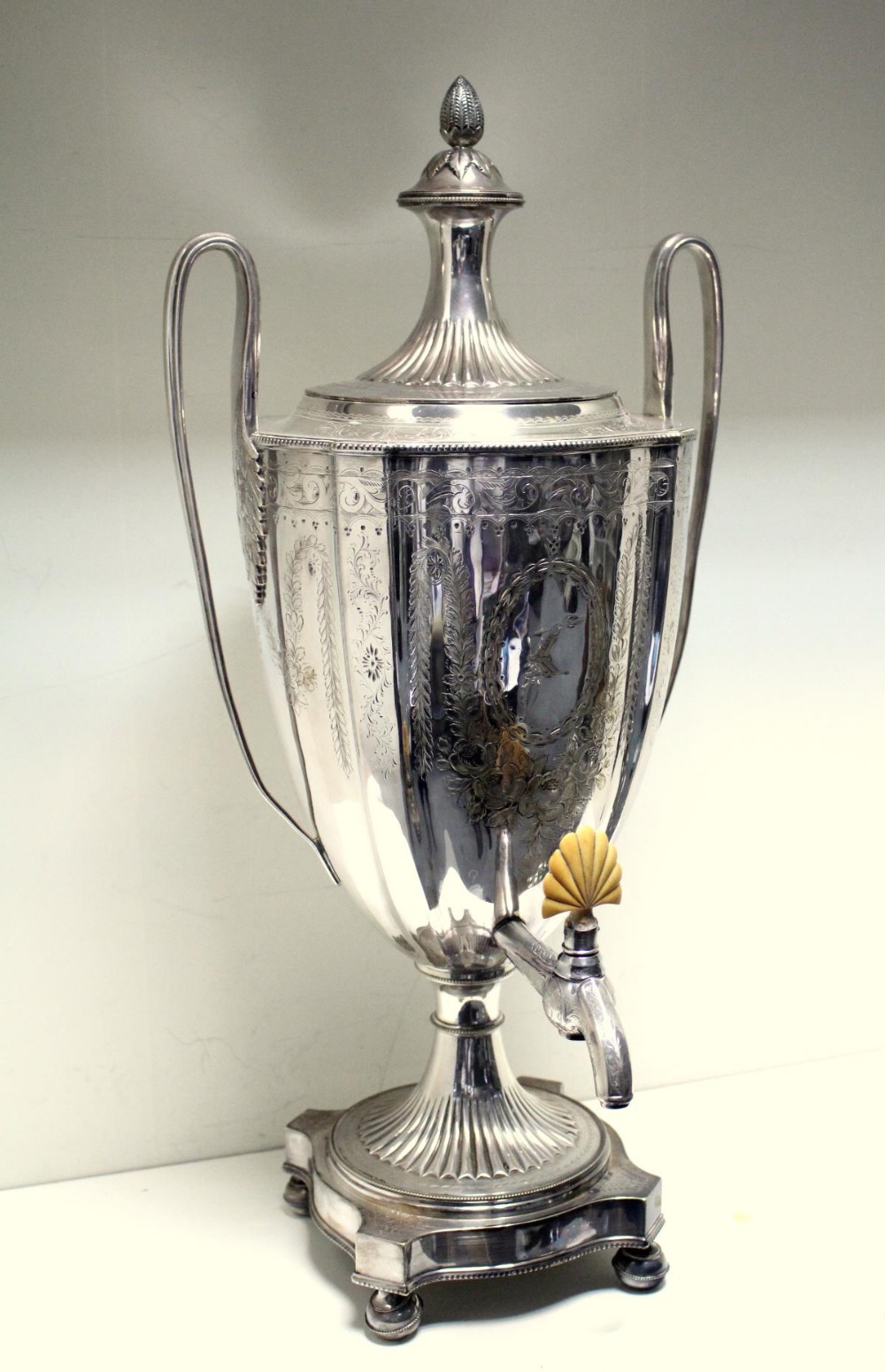 A Victorian electroplate tea urn in the neo-classical style, unmarked, the vase shaped body engraved - Image 2 of 7