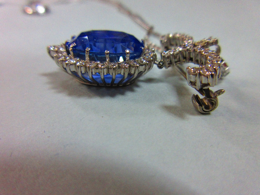 A sapphire and diamond pendant / brooch with white gold chain, the jewel designed as a large oval - Image 5 of 5