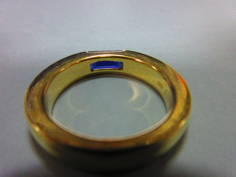 A contemporary iolite ring by Quinn, the rectangular step cut iolite tension set horizontally in a - Image 3 of 5