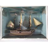 HMS Victory 1765', a cased model of the battleship, only the stern mast with furled plastic sails,