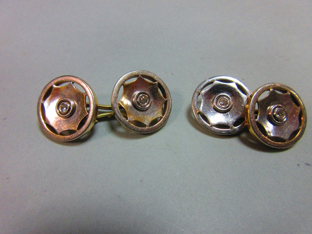 A pair of diamond set double ended cufflinks, each 1.5cm diameter end designed as a stylised wheel - Image 2 of 4