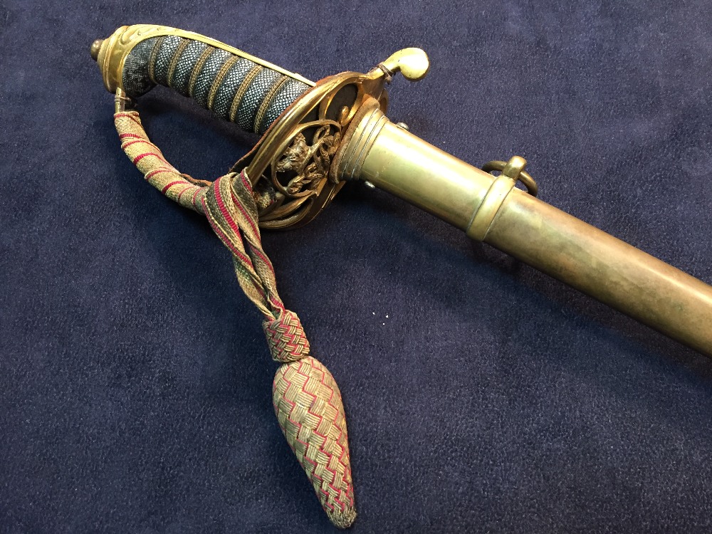 A Victorian officer's dress sword, with etched blade, unsigned, VR ciphers, pierced guard with