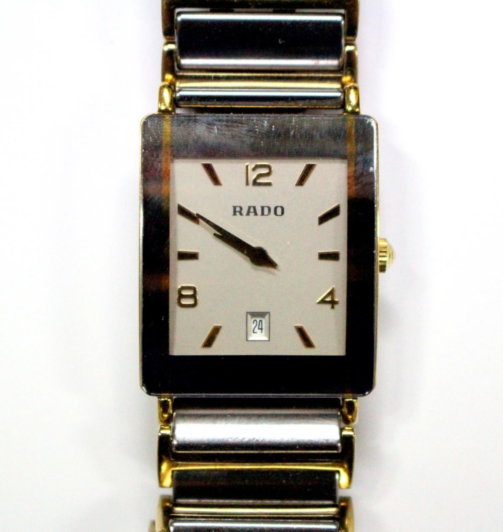 By Rado - a unisex 'Diastar' steel , titanium and gold plated quartz wristwatch, the rectangular