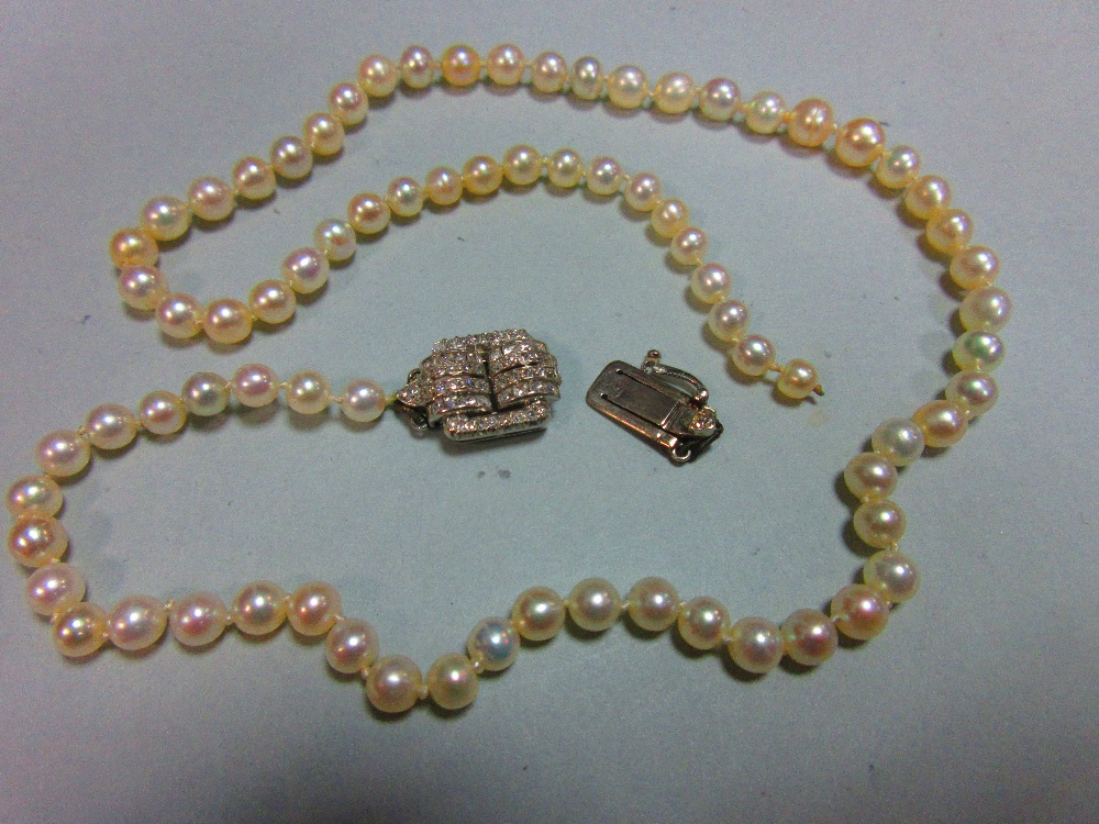 A pearl necklace with art deco diamond clasp, the individually knotted string of graduated 3.8-5.2mm - Image 4 of 5