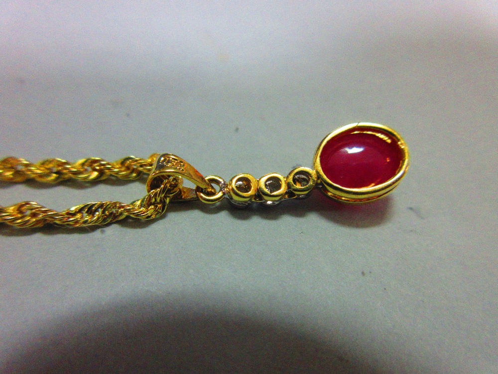 A ruby and diamond pendant with gold chain, the pendant designed as an articulated line of collet - Image 4 of 4