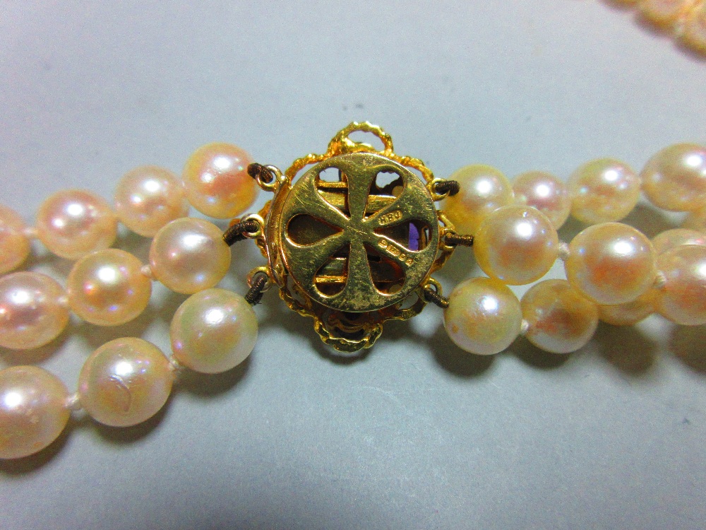 A three row pearl necklace with gold, amethyst and seed pearl clasp, the uniform 7.5-8mm cultured - Image 3 of 6