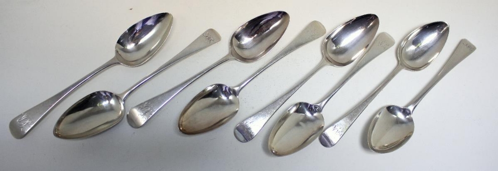 A matched set of eight George III silver Old English pattern table spoons, five by William Sumner,