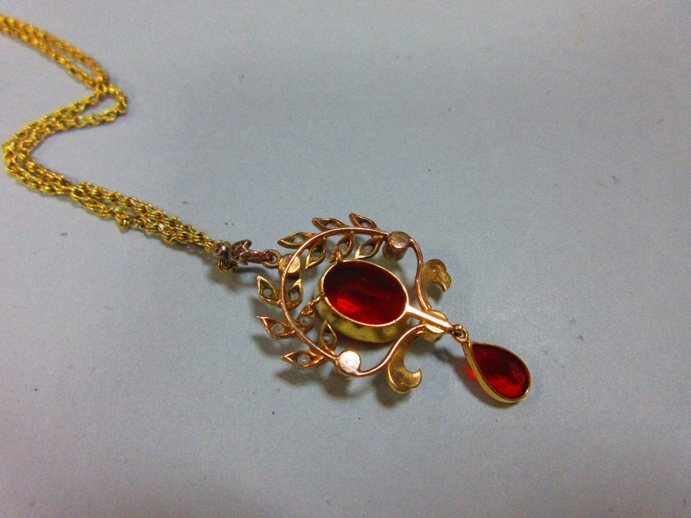 A belle époque fire opal, diamond and seed pearl pendant with chain, the oval cut fire opal collet - Image 3 of 4