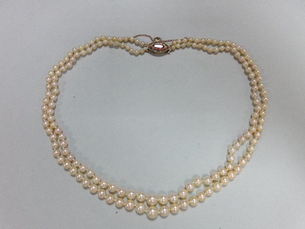 A two row pearl necklace with ruby and diamond clasp, the 3.6 - 8.0mm graduated pearls, to a navette - Image 6 of 7