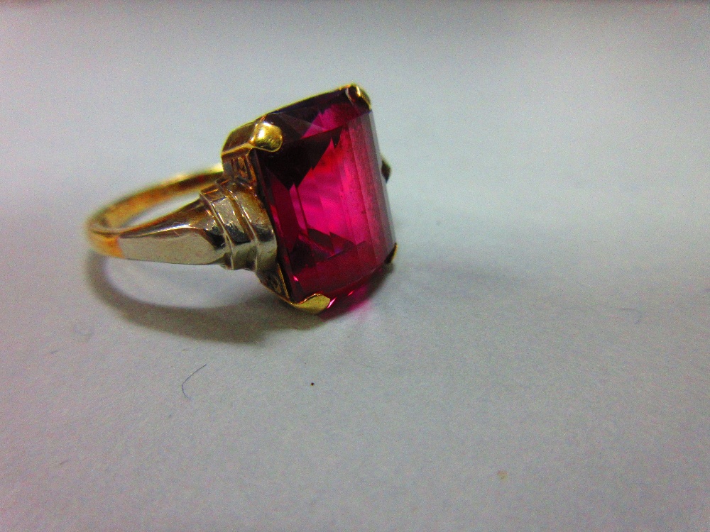 An Austrian single stone synthetic red spinel ring, the fancy cut rectangular pinky-red spinel, claw - Image 8 of 8