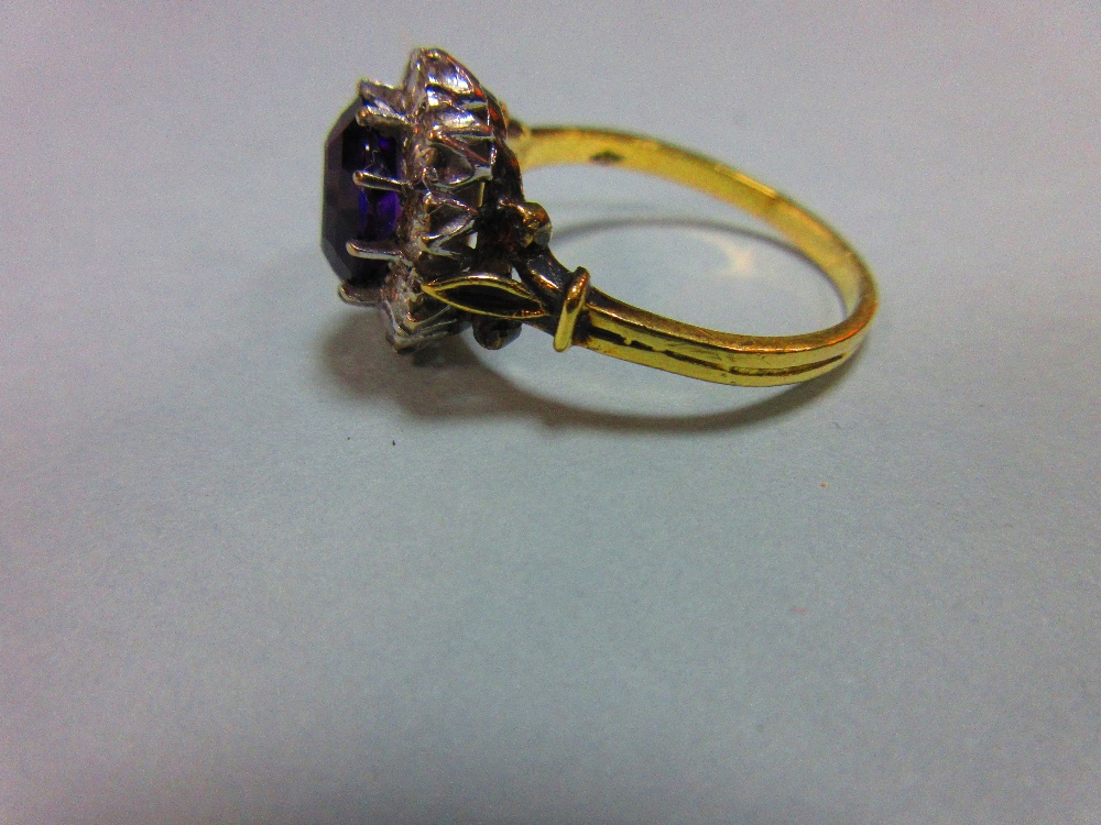 An amethyst and diamond cluster ring, the oval mixed cut rich purple amethyst claw set in a border - Image 3 of 8