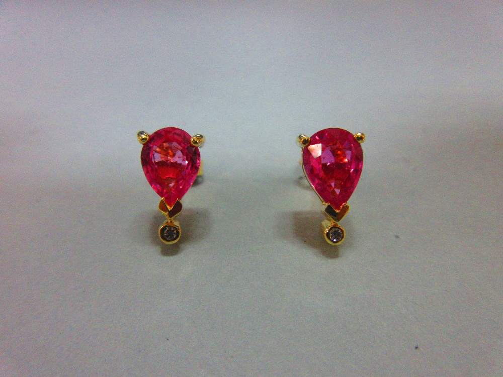 A pair of pink sapphire, diamond and 18ct gold earstuds, each post headed by a three claw set pear - Image 5 of 5