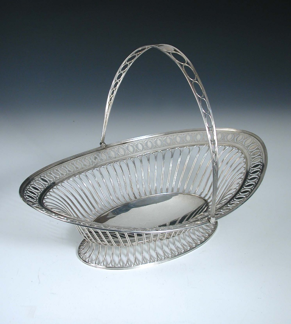 A George III silver cake basket, by Luke Proctor & Co, Sheffield 1792, of oval shape, the body and