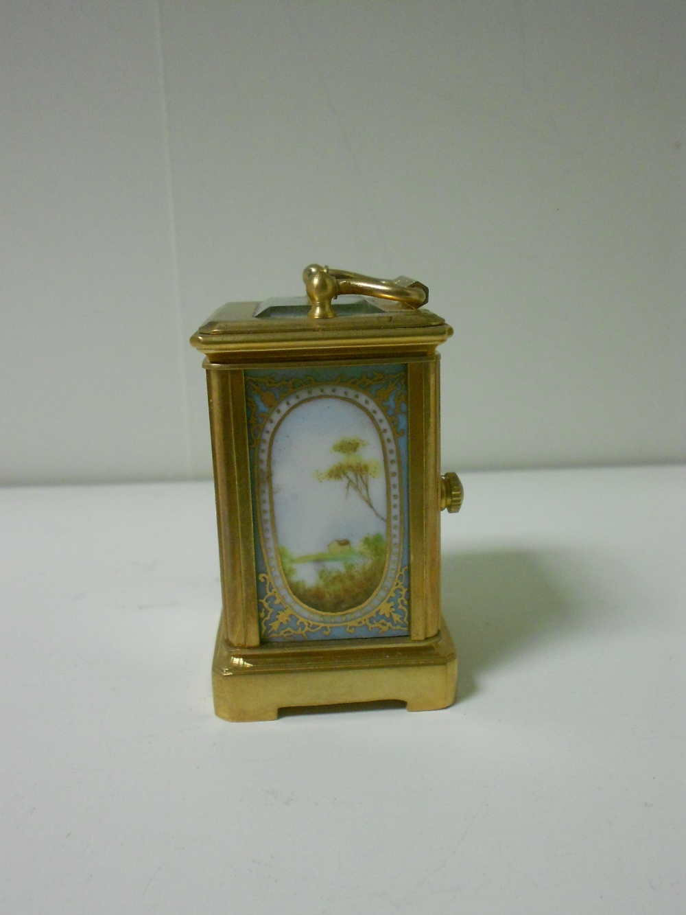 A miniature French porcelain panel gilt brass carriage timepiece, with gilt decorated pale blue - Image 2 of 5