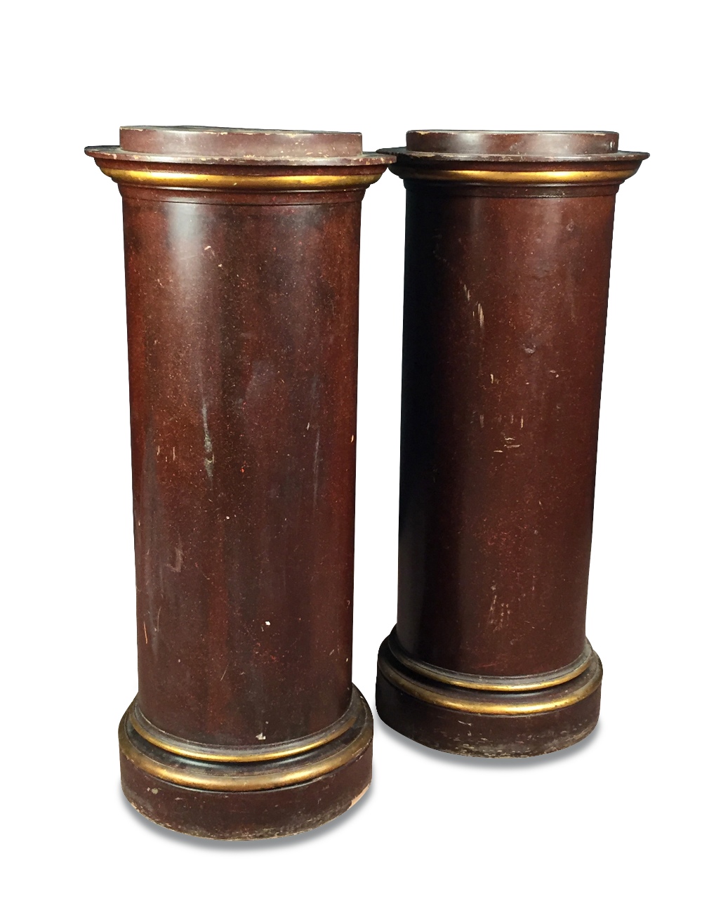 A pair of faux porphyry pedestal columns, with moulded gilt edged capitals and plinth bases (2)