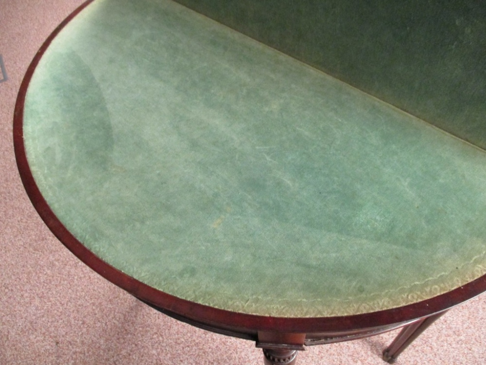 A George IV mahogany demi lune card table, with foldover top, green velvet lined interior, on - Image 2 of 5