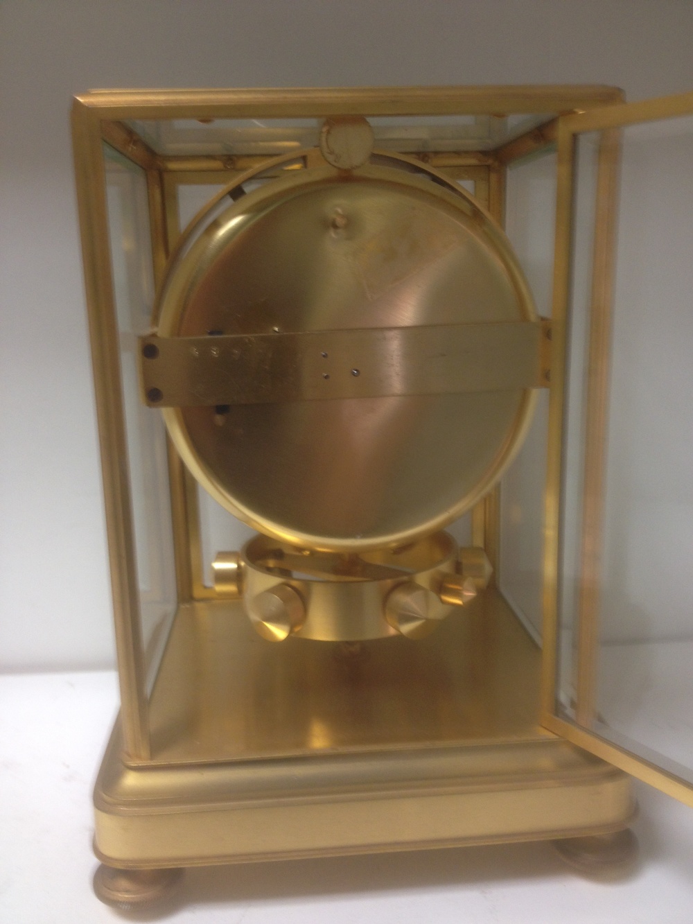 An early Atmos mantle clock by J. L. Reutter, serial no. 123, the bevelled glazed gilt frame case - Image 3 of 4