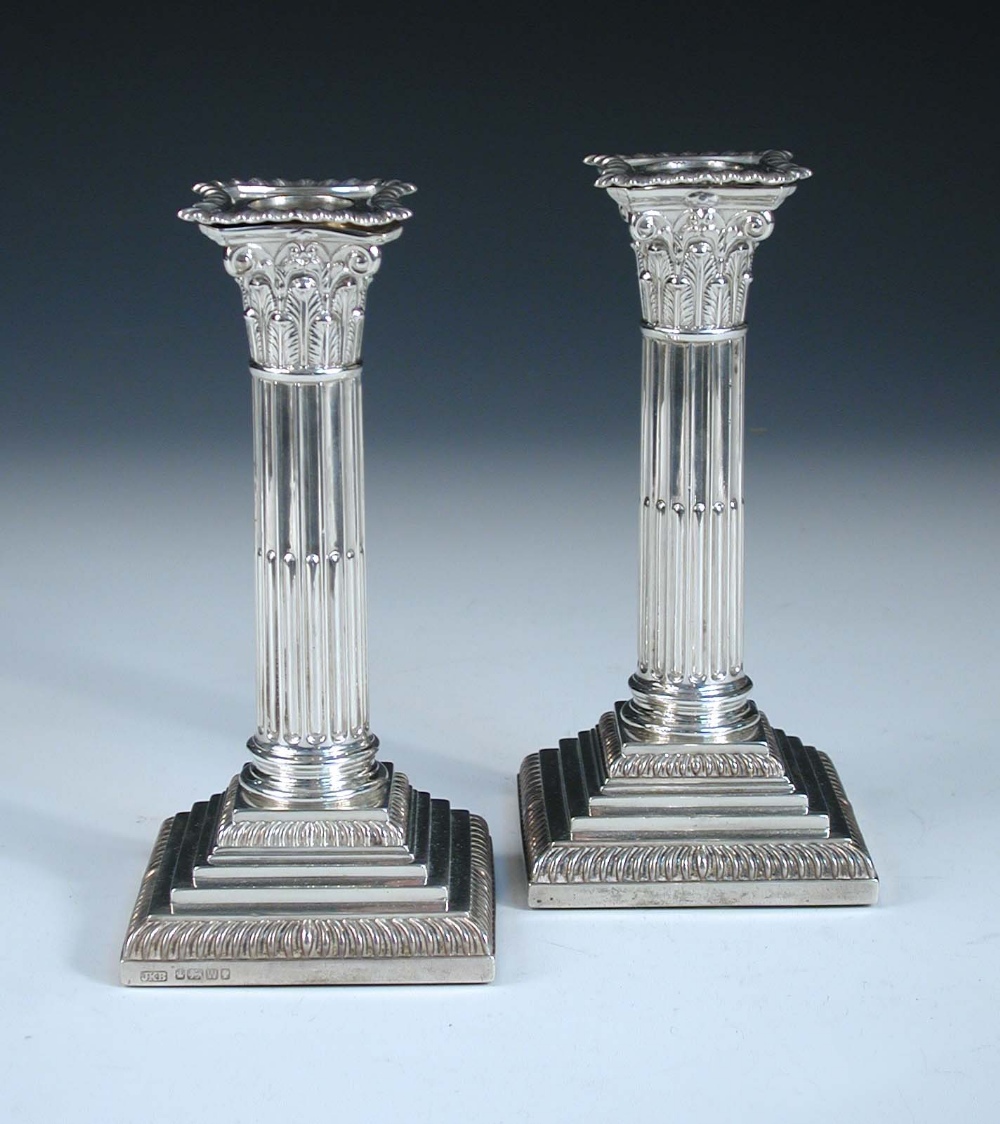 A pair of dwarf silver candlesticks, by James Kebberling Bembridge (Hawksworth, Eyre & Co Ltd),