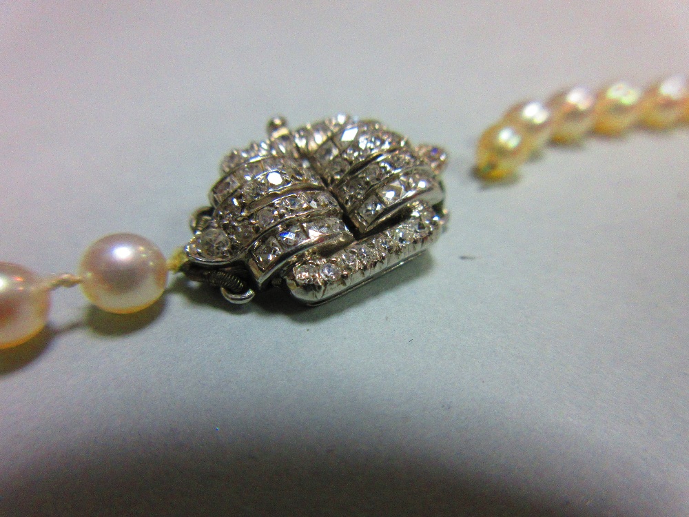 A pearl necklace with art deco diamond clasp, the individually knotted string of graduated 3.8-5.2mm - Image 3 of 5