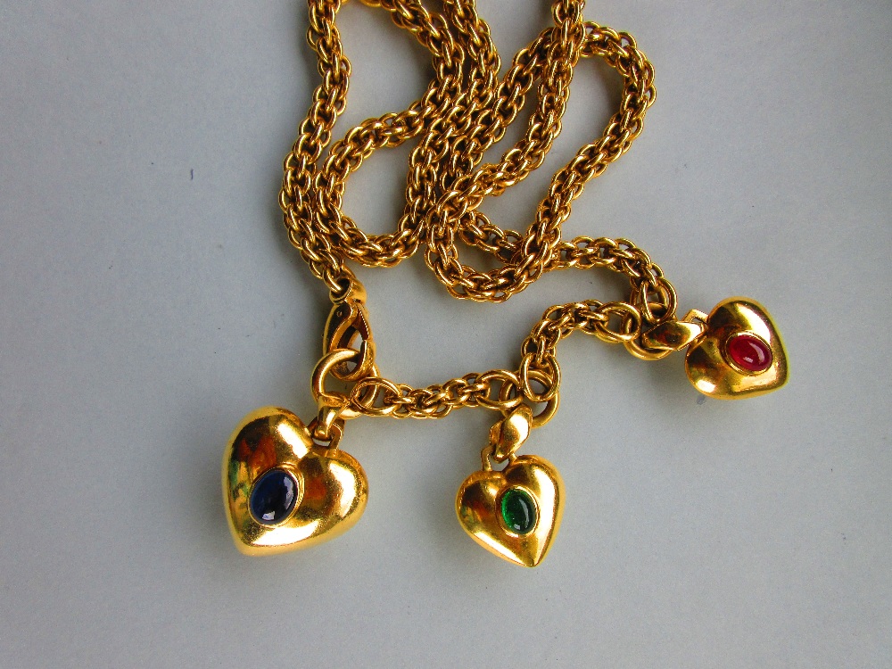 An Italian heavy fancy link necklace with three gemset heart-shaped pendants, each link formed by