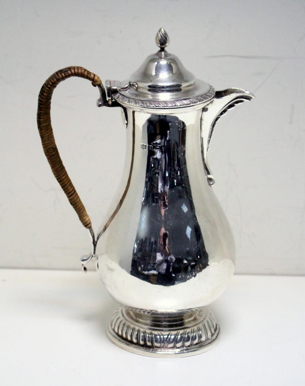 An Edwardian silver hot water jug, by Marston & Bayliss, Birmingham 1905, the plain baluster body