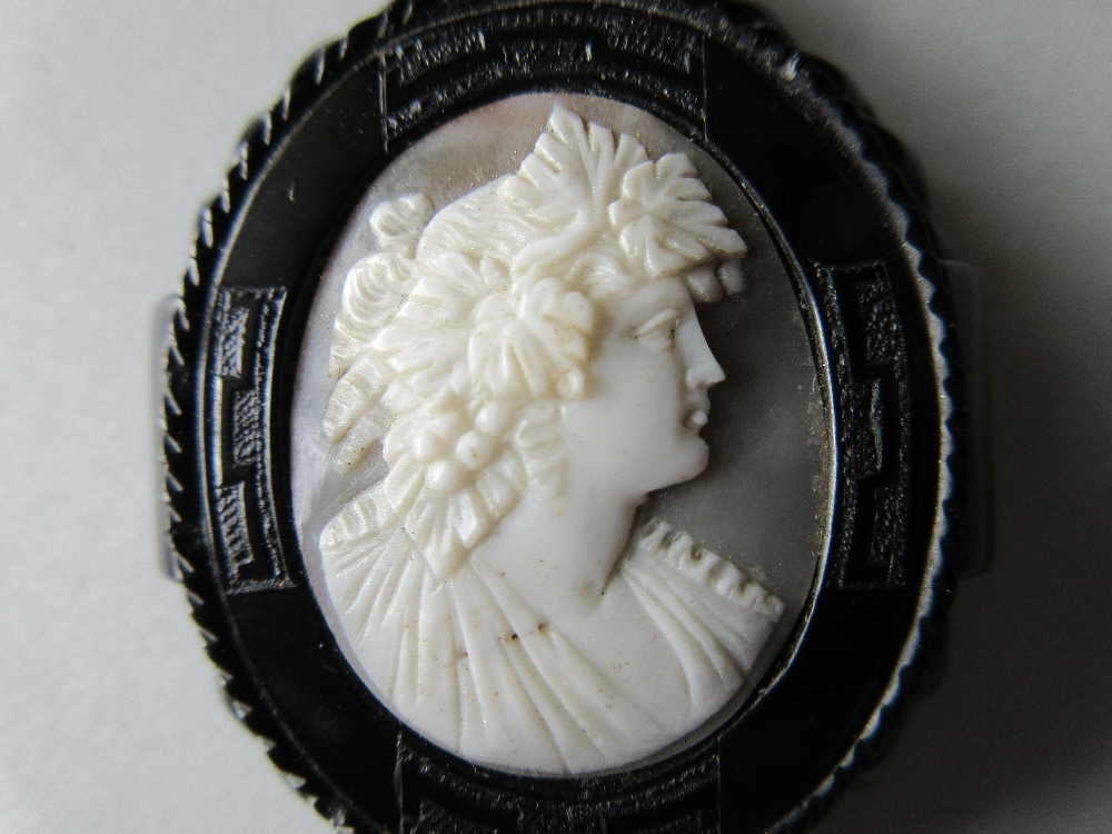 A Victorian carved jet mounted shell cameo pendant, the white on grey cameo depicting a Bacchante in - Image 3 of 6