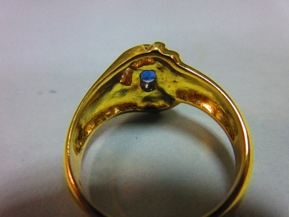 A modern asymmetrical 18ct gold and gemset ring, with a central claw set oval cut vivid blue - Image 3 of 5