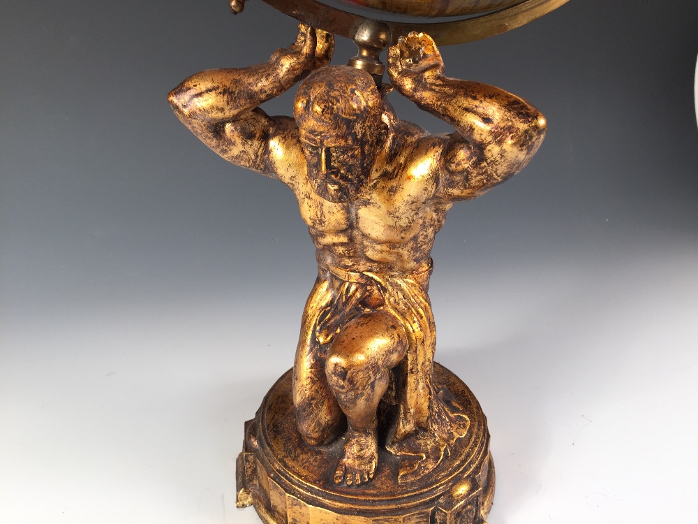 A Geographia 10 inch terrestial globe, early 20th century, supported on a gilt metal figure of Atlas - Image 3 of 3