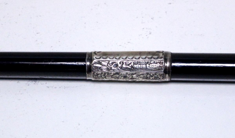 A silver mounted ebony conductor's baton, the cap by Joseph Taylor, Birmingham 1903, the central - Image 3 of 4