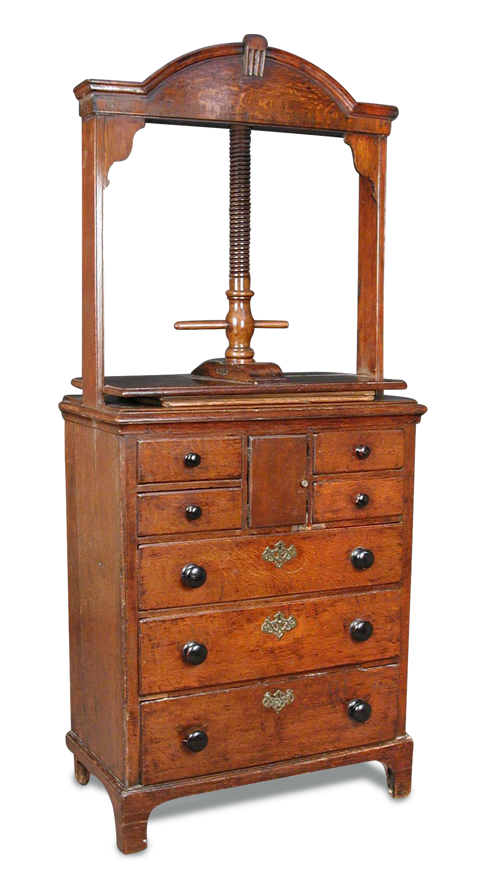 A late 18th century oak Norfolk linen chest, with screw press and later turned wood handles, on