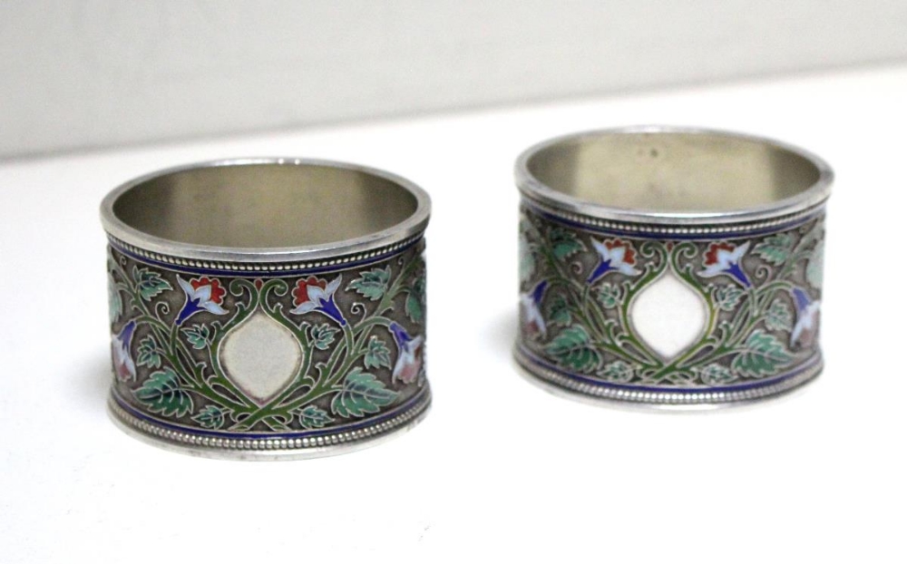 Two Russian silver and cloisonné enamel napkin rings. by Grachev, St Petersburg, 1896 (88 zol.),