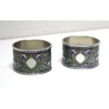 Two Russian silver and cloisonné enamel napkin rings. by Grachev, St Petersburg, 1896 (88 zol.),