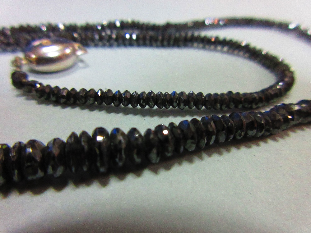 A black diamond bead necklace, the graduated 2.5 - 5.3mm diameter faceted black diamond beads, - Image 2 of 5