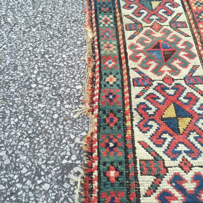 A Caucasian rug, 187 x 113cm (73 x 44in) Worn with low pile, ridging, border losses and binding - Image 2 of 6