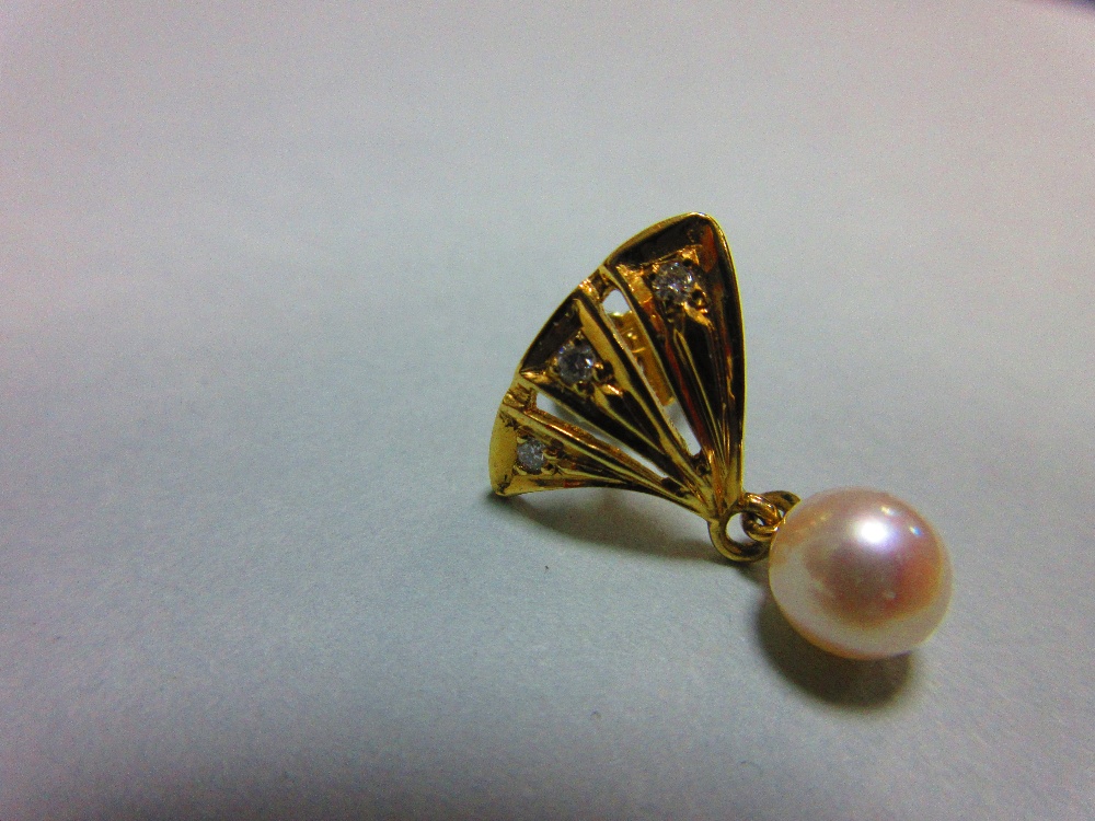 A pair of pearl and diamond earstuds, each with a pierced triangular fan motif set with three - Image 3 of 3