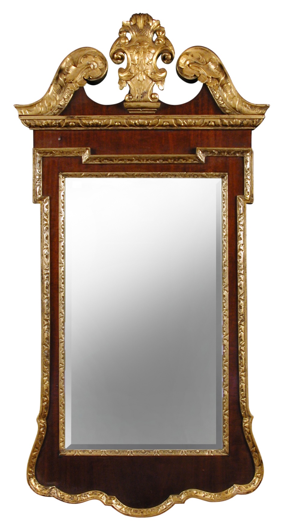 A George II style mahogany and parcel gilt pier glass, with break arch pediment and cartouche shaped