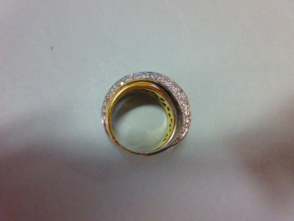 A modern diamond crossover band ring, of precious metal stamped '750' and designed as a plain - Image 4 of 6