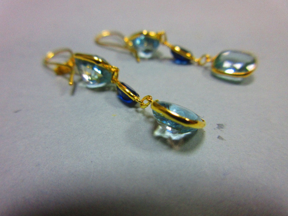 A pair of aquamarine and sapphire earrings, each gold wire hook suspending an articulated line of - Image 2 of 4