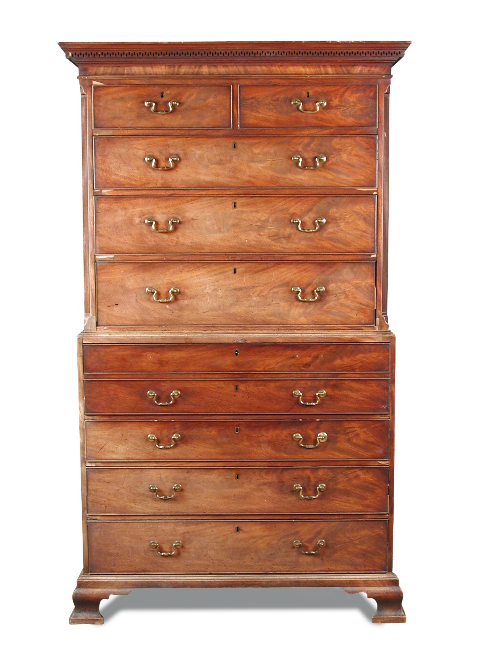 A George III mahogany secretaire chest on chest, with a greek key moulded cornice, canted reeded