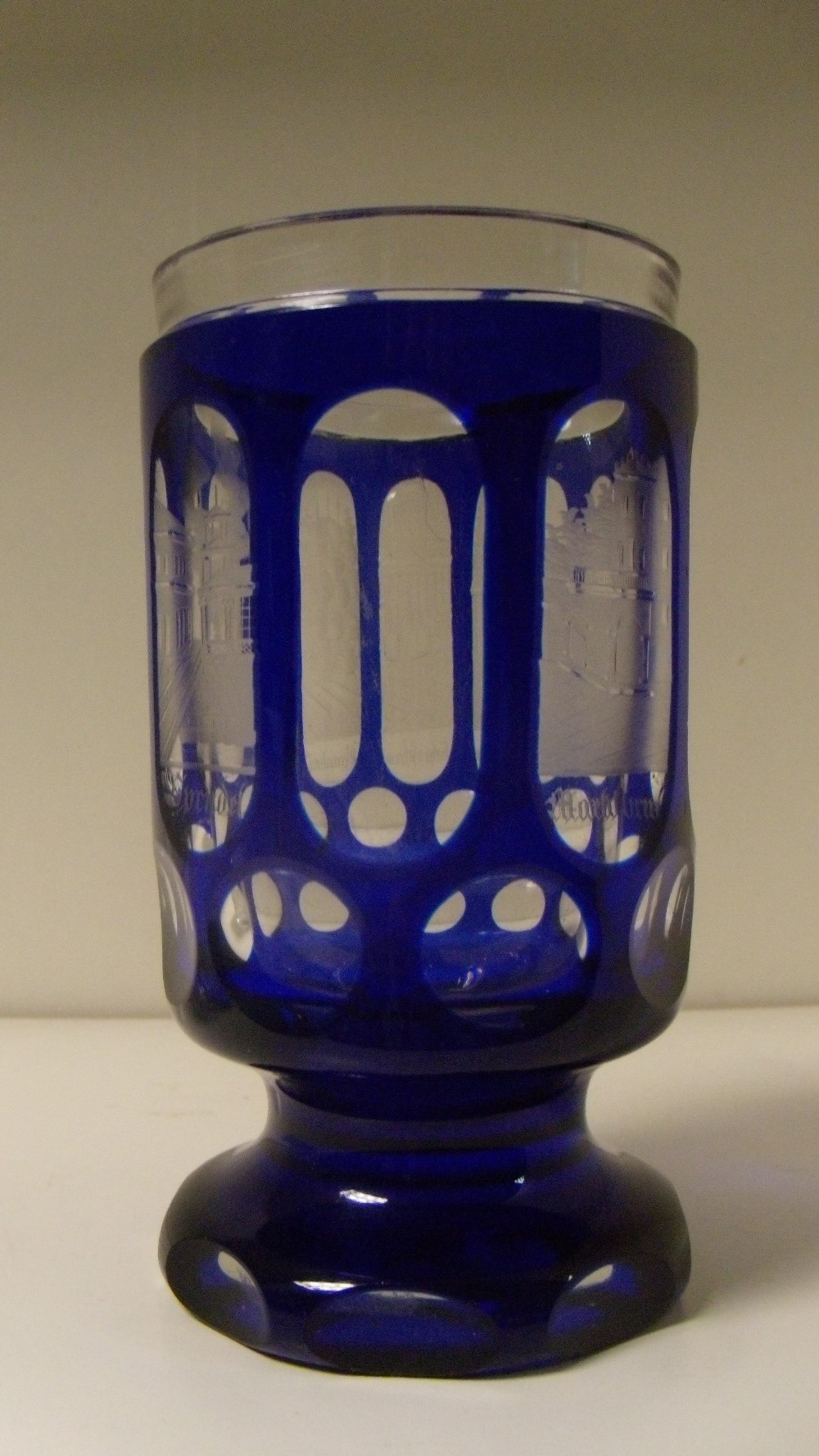 A mid 19th century Bohemian blue overlay tumbler, seven of the eight oval windows to the cylindrical - Image 2 of 2