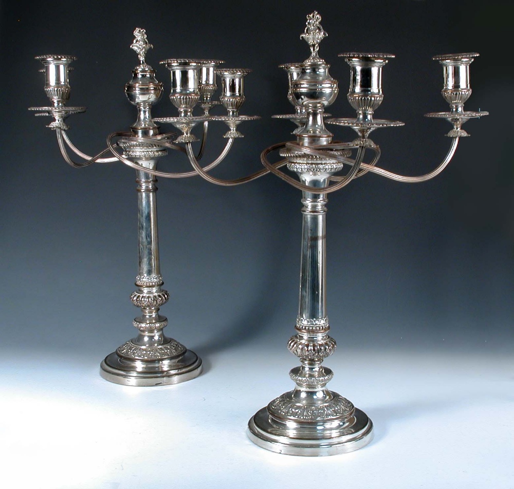 A very large pair of Old Sheffield plate candelabra, by Matthew Boulton, the bases rising from a