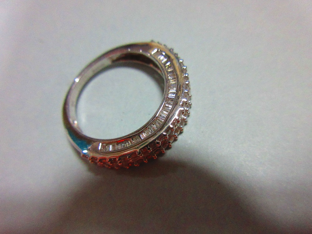 A white gold and diamond half hoop ring, with a channel set line of baguette cut diamonds between - Image 5 of 6